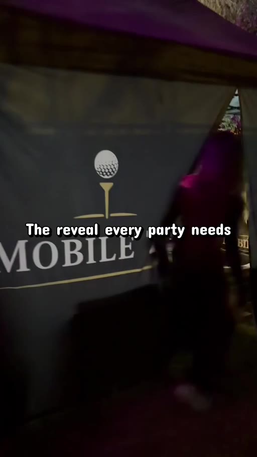 Mobile Tee signage at an evening golf simulator event